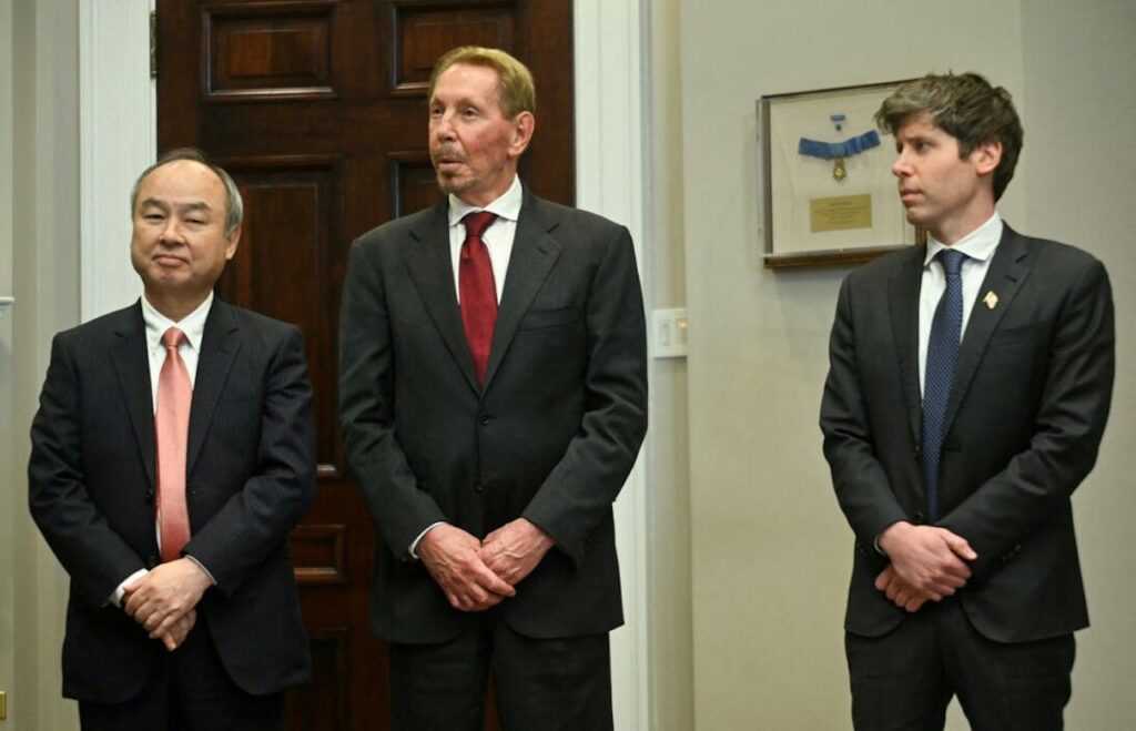 Masayoshi Son, CEO of SoftBank, Larry Ellison, co-founder of Oracle, and Sam Altman, CEO of OpenAI, posing together at Trump's second inauguration